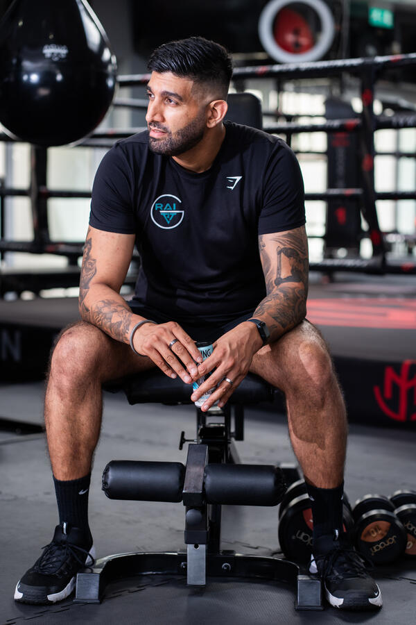 Personal trainer sitting on the bench Personal trainer sitting on the bench