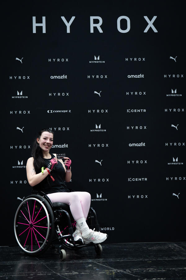 Adaptive athelete celebrating finishing of Hyrox race